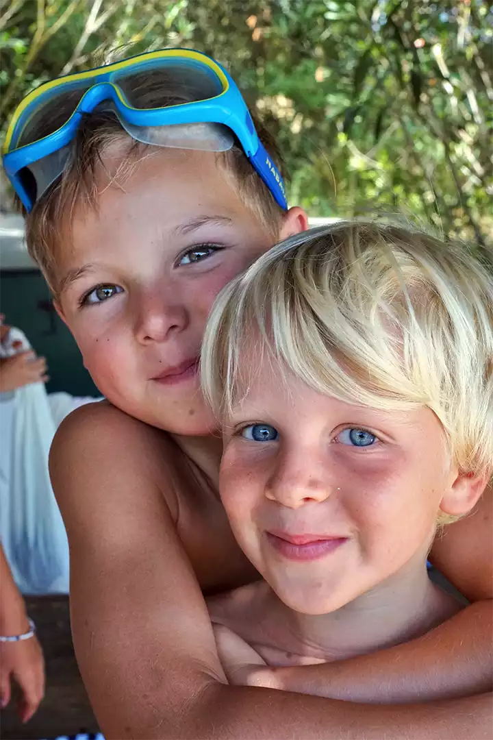 Campers smiling together outdoors