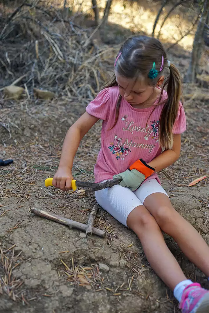 A child making a project at camp